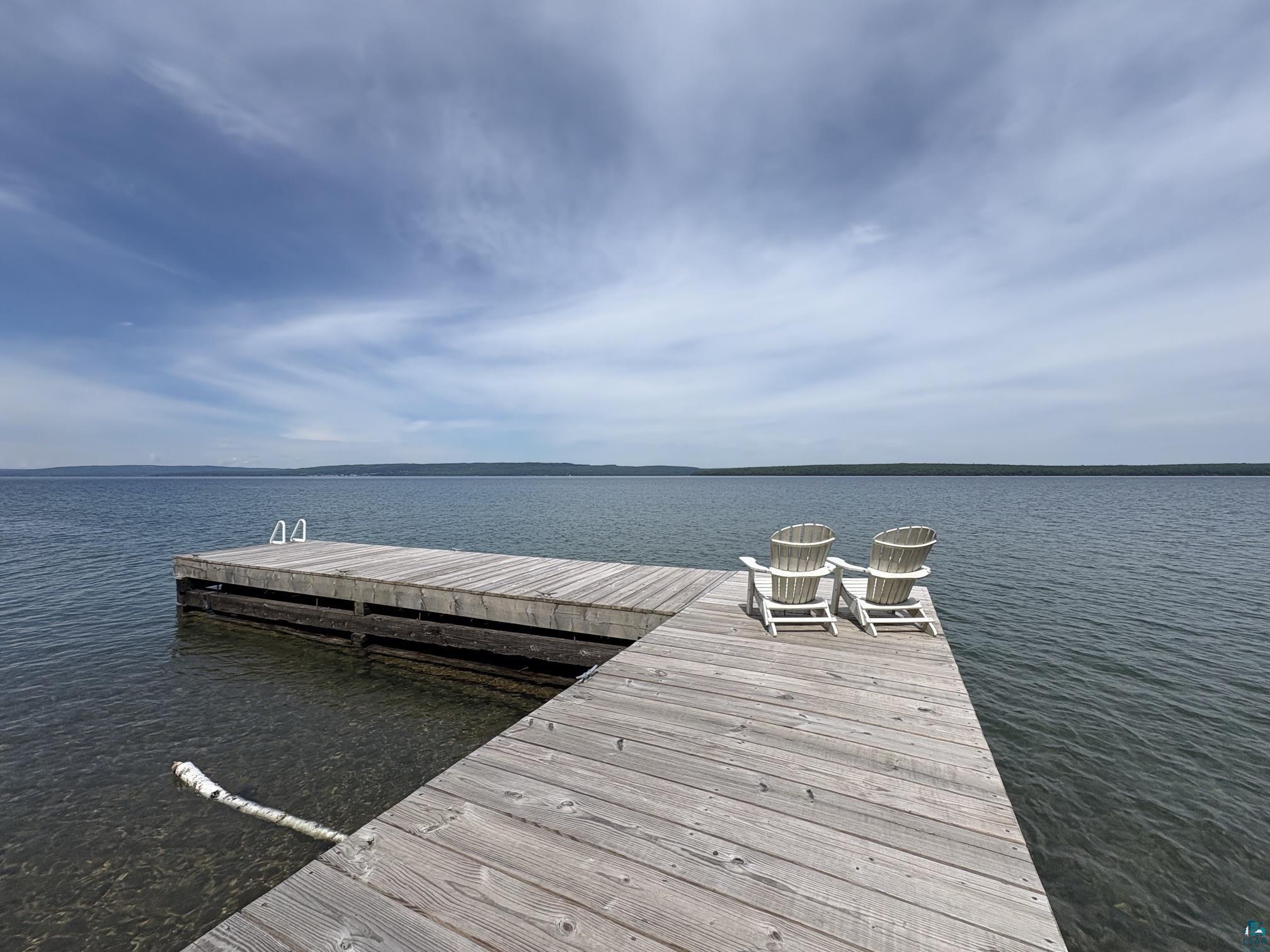 1596 North Shore Road La Pointe, WI 54850 - Photo 19 of 21 Wooden dock extending over calm water, featuring a ladder for water access