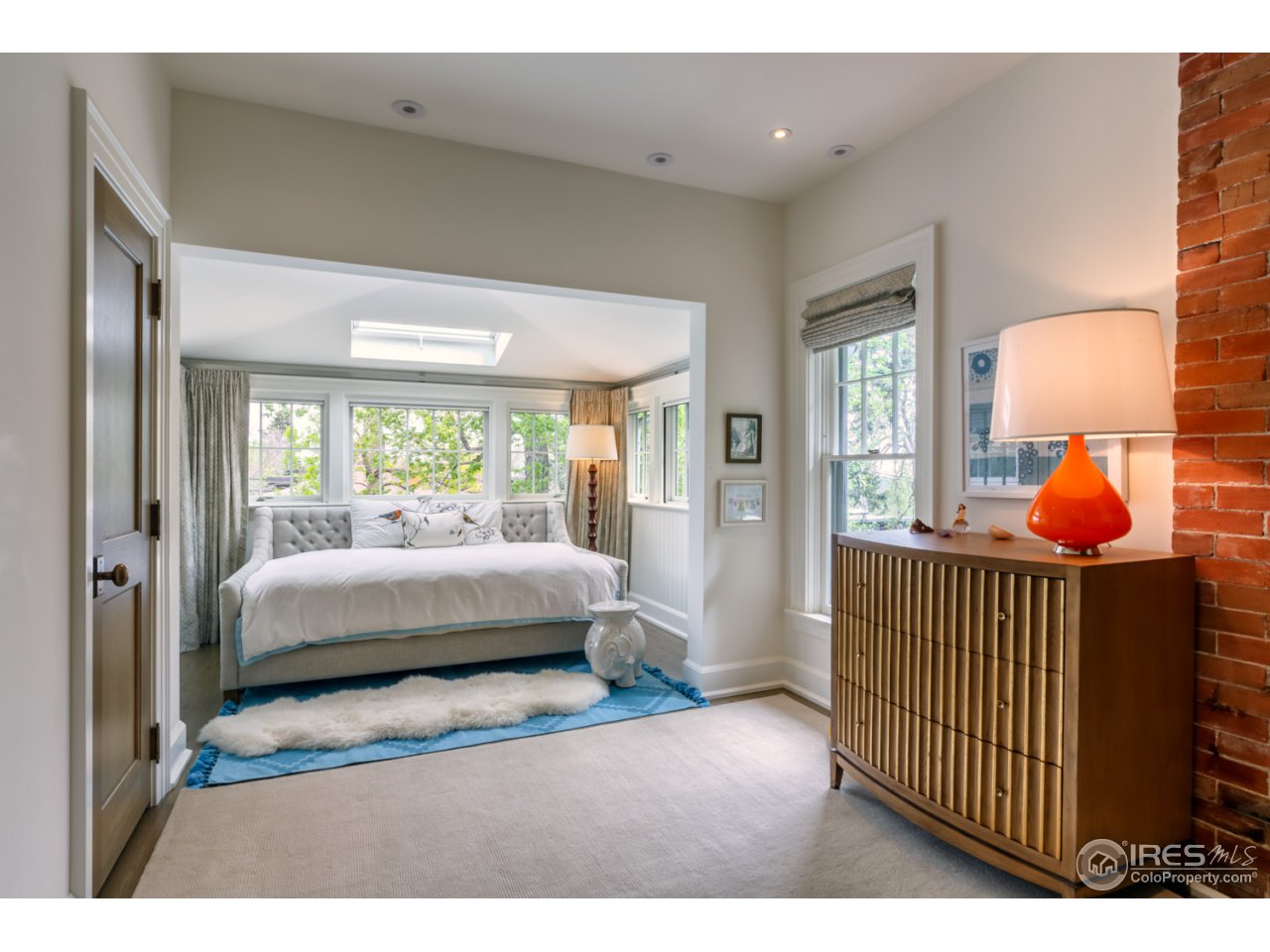 933 Mapleton Avenue Boulder, CO 80304 - Photo 8 of 14 a bedroom with a bed and a window