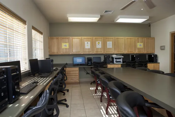 a view of a kitchen with dining table and chairs