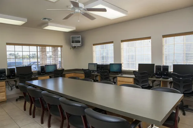 a kitchen with a table chairs and a counter top space