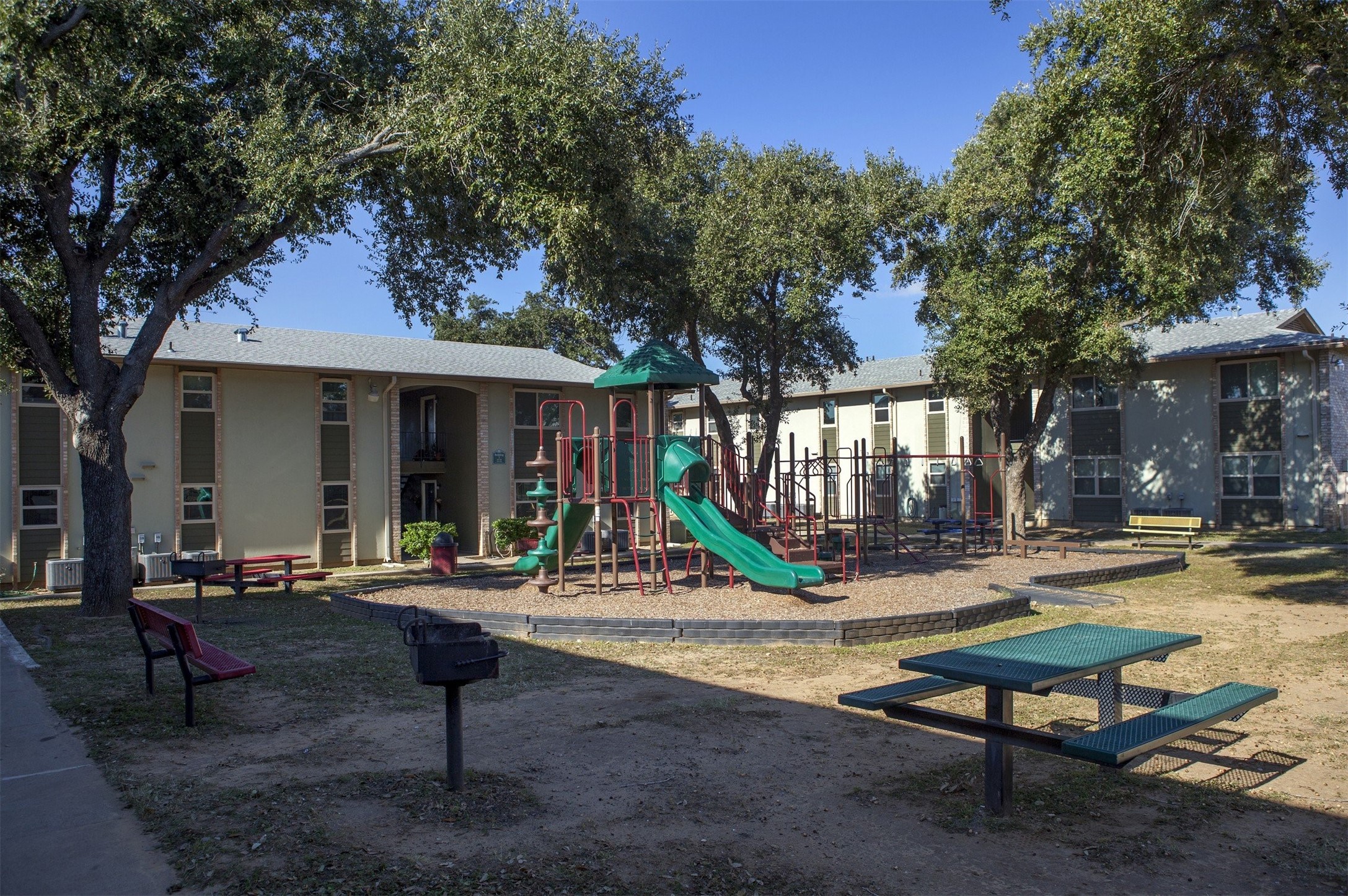 300 East Mann Road Laredo, TX 78041 - Photo 4 of 15 a building outdoor space with patio furniture and potted plants