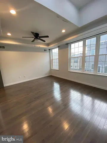 a spacious bathroom with a shower sink and mirror