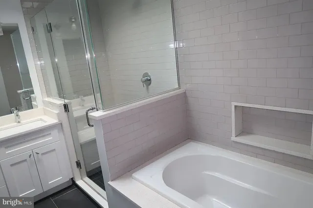 a kitchen with stainless steel appliances granite countertop a sink and a stove