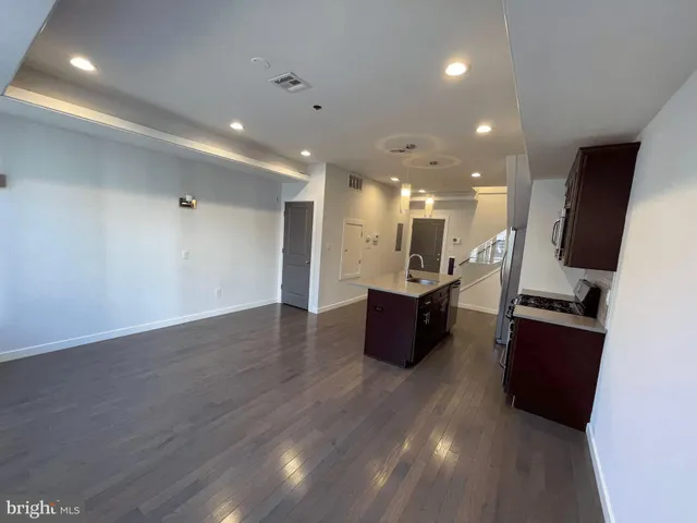 a bathroom with a double vanity sink a mirror and a shower