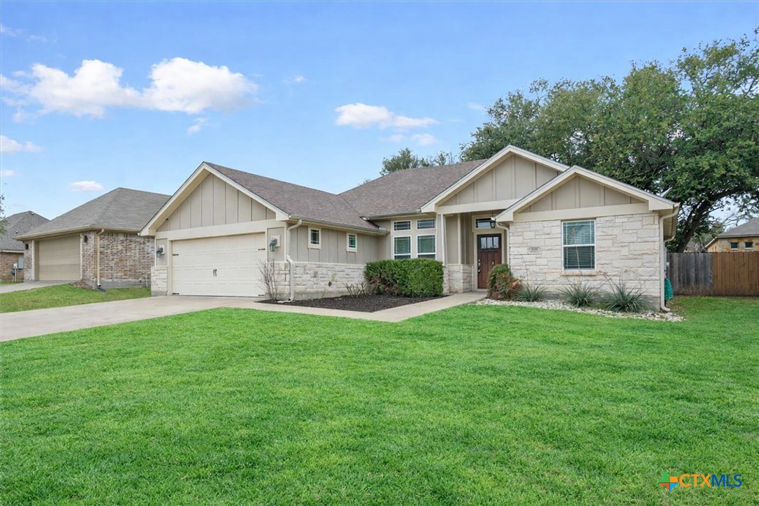 198 Sheridan Loop Belton, TX 76513 - Photo 2 of 31 a view of a yard in front of a house with large trees