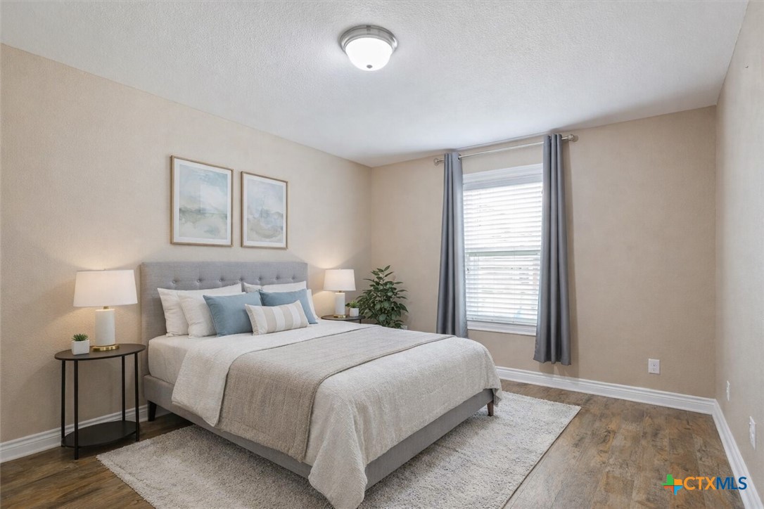 198 Sheridan Loop Belton, TX 76513 - Photo 23 of 31 a bedroom with a bed and a night stand