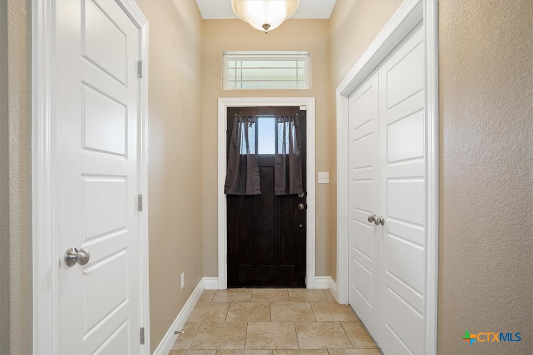198 Sheridan Loop Belton, TX 76513 - Photo 4 of 31 a view of a hallway with wooden floor and closet