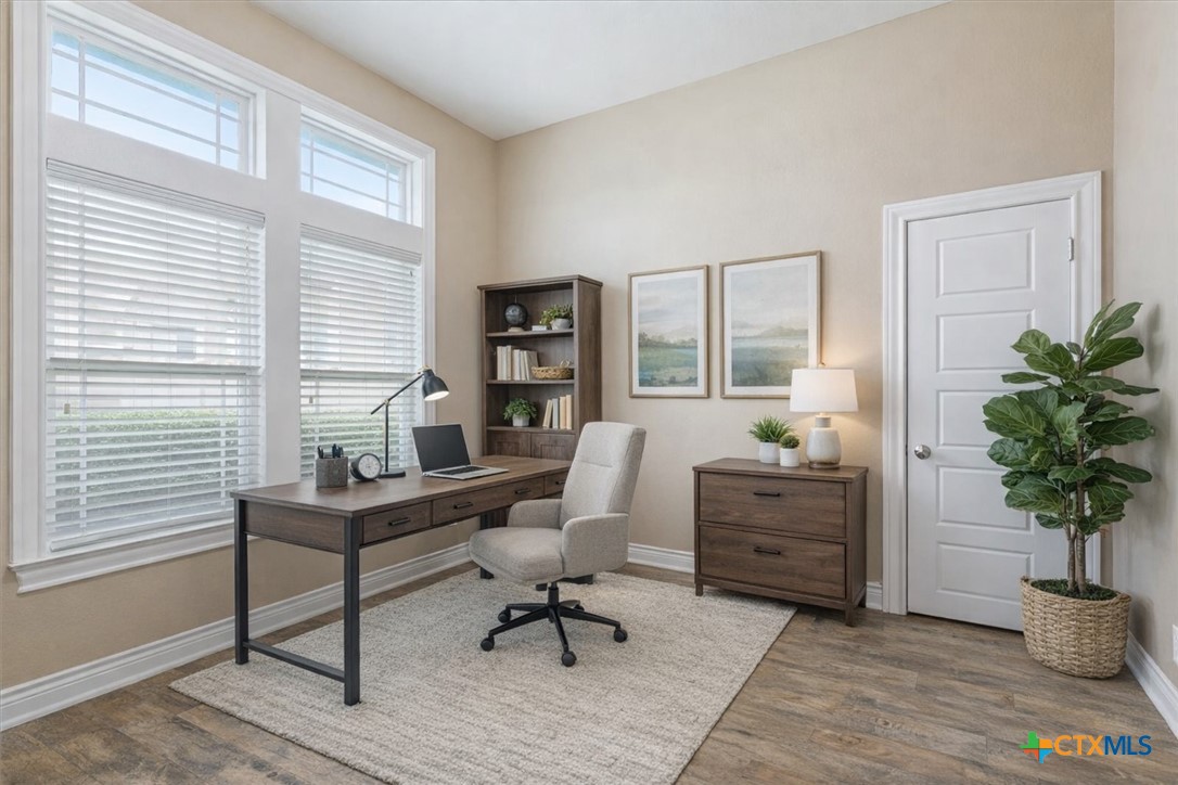 198 Sheridan Loop Belton, TX 76513 - Photo 5 of 31 a living room with furniture a potted plant and a large window