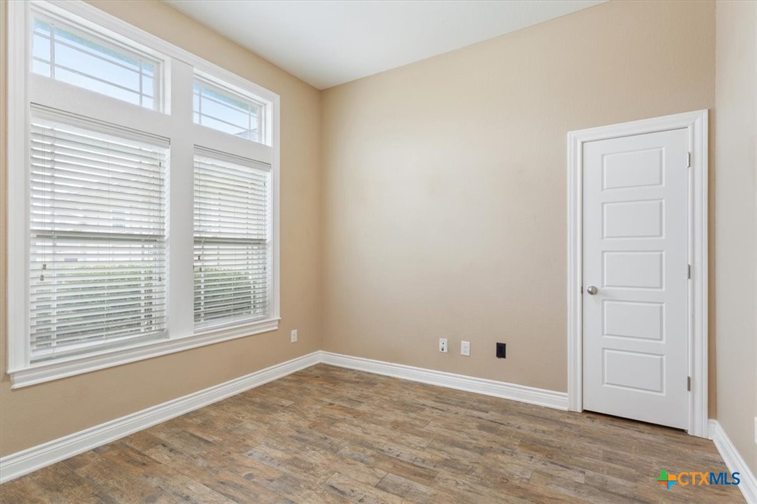 198 Sheridan Loop Belton, TX 76513 - Photo 6 of 31 a view of empty room with wooden floor and fan