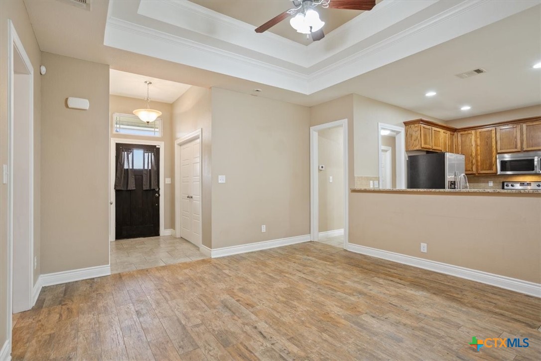198 Sheridan Loop Belton, TX 76513 - Photo 8 of 31 a view of a kitchen with a sink and a refrigerator