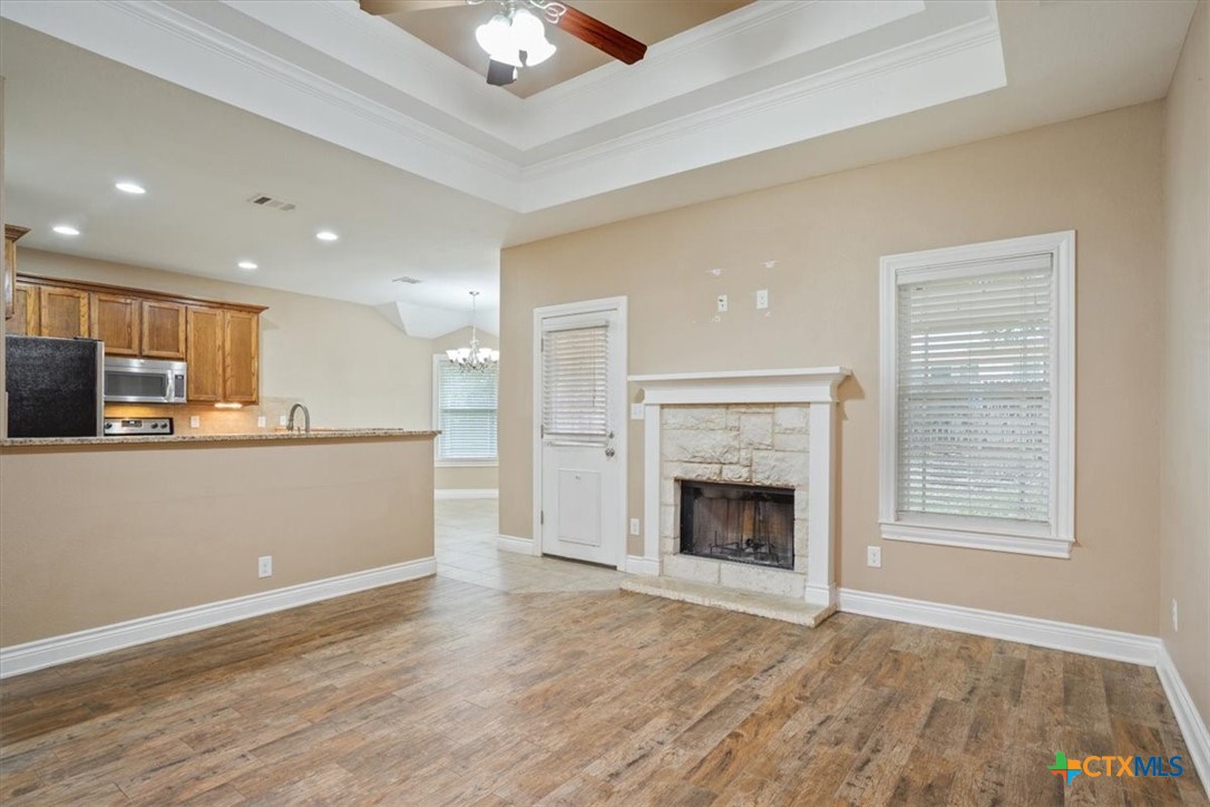 198 Sheridan Loop Belton, TX 76513 - Photo 10 of 31 a view of an empty room with kitchen and a window
