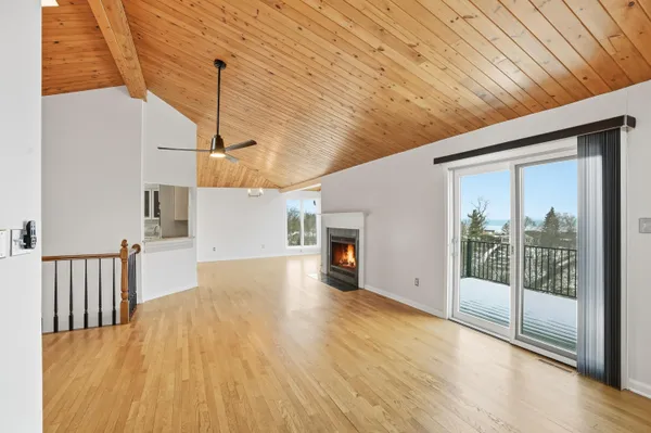 a view of an entryway with wooden floor