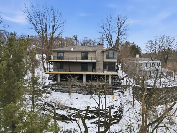 a view of a house with a snow in the yard