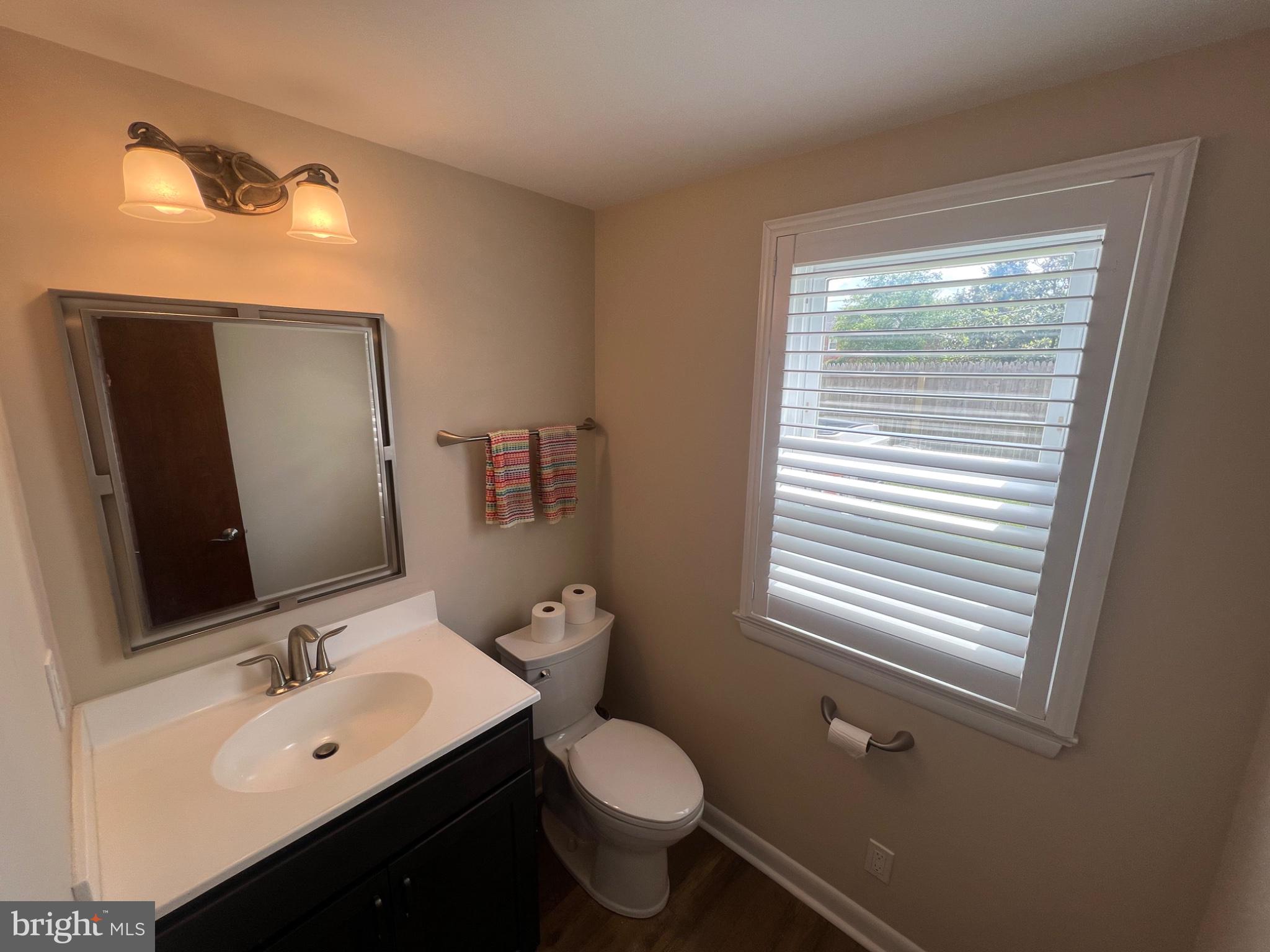 20 Fairview Road Swarthmore, PA 19081 - Photo 9 of 24 a bathroom with a toilet sink and mirror