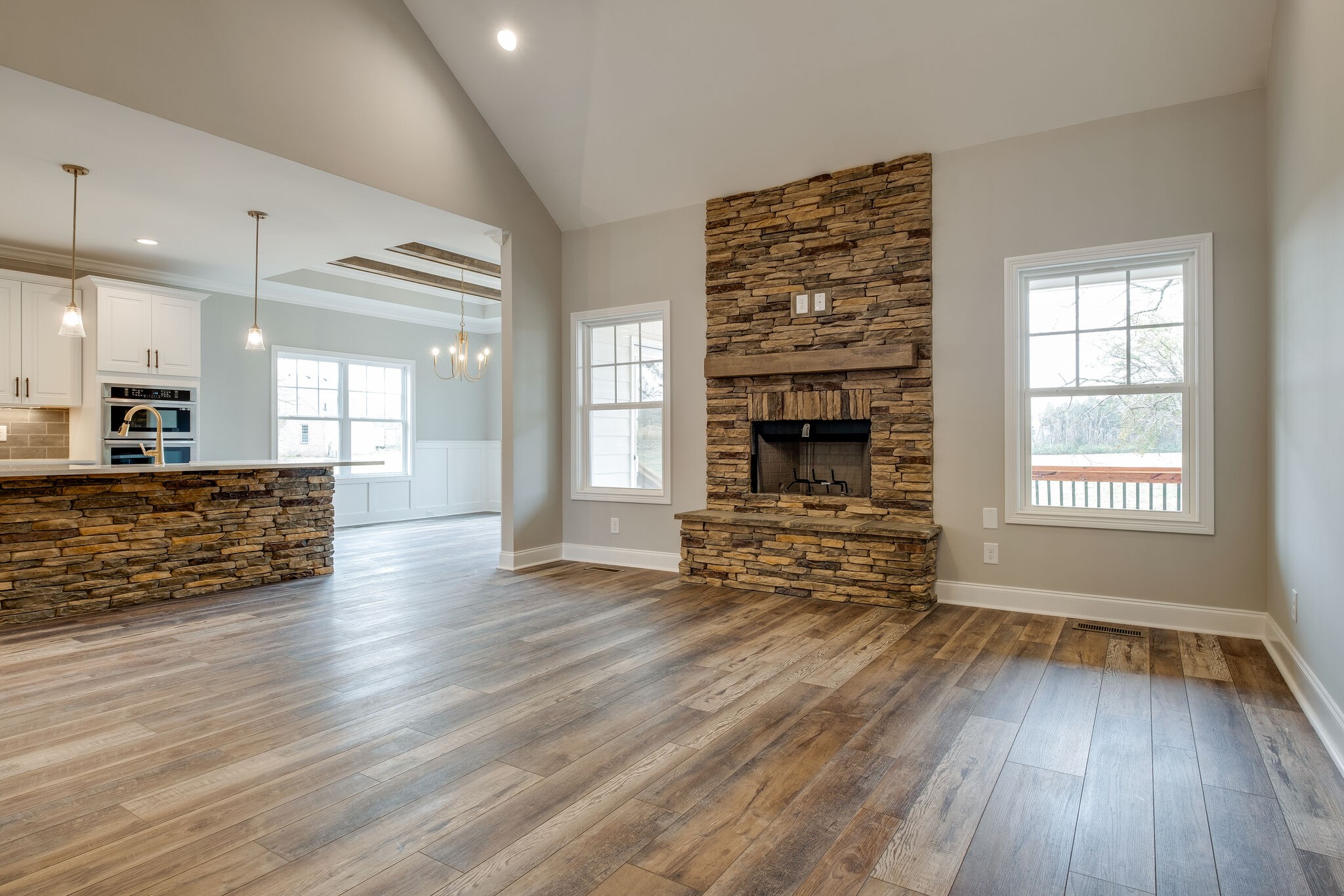 435 Northern Road Mount Juliet, TN 37122 - Photo 8 of 44 an empty room with wooden floor fireplace and windows