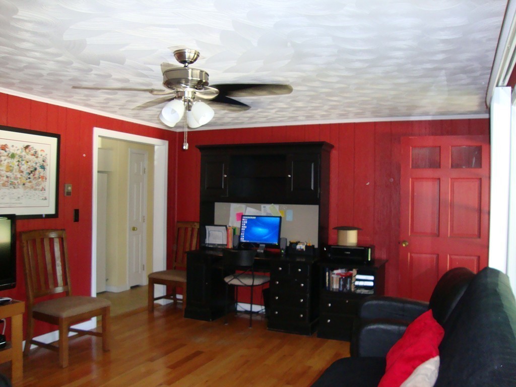 63 Pierpont Road Dudley, MA 01571 - Photo 14 of 21 a living room with furniture and a flat screen tv