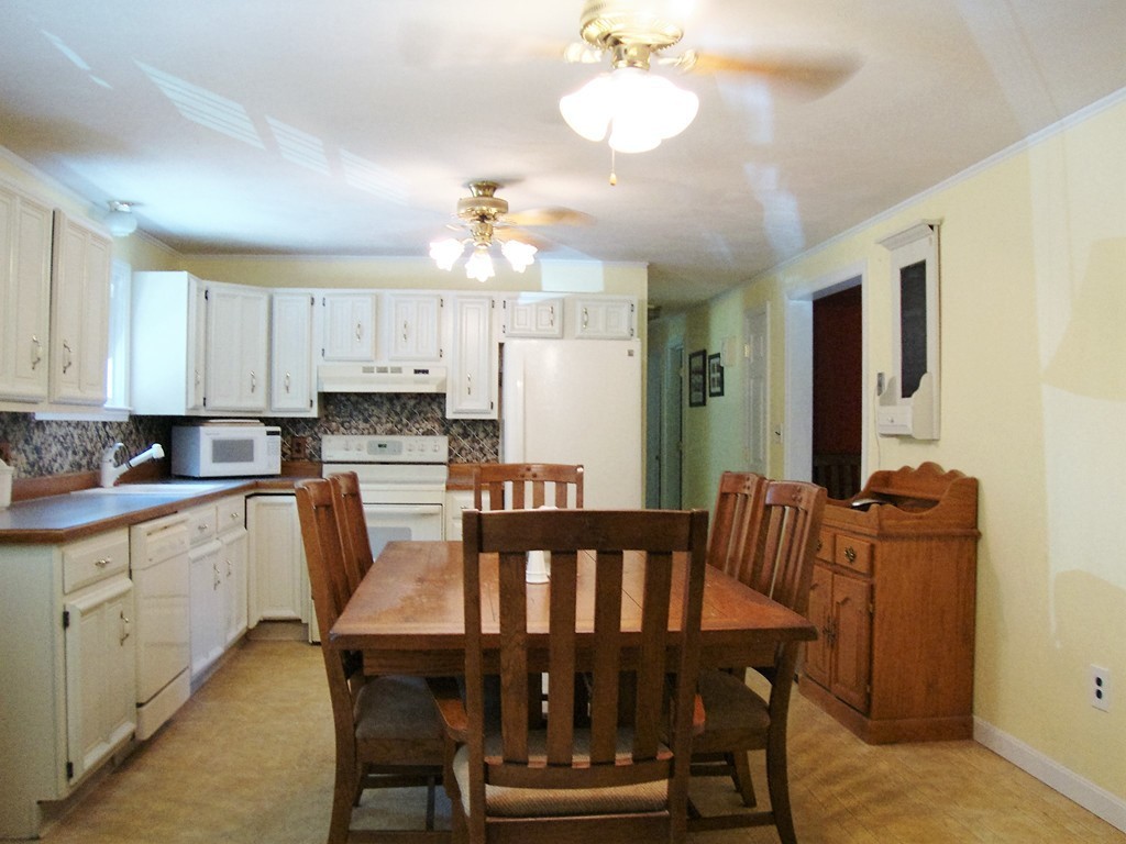 63 Pierpont Road Dudley, MA 01571 - Photo 8 of 21 a view of a dining room with furniture