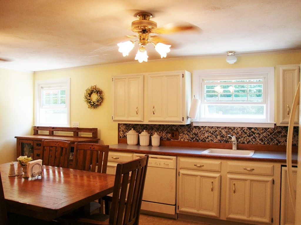 63 Pierpont Road Dudley, MA 01571 - Photo 10 of 21 a view of a dining room with furniture and chandelier