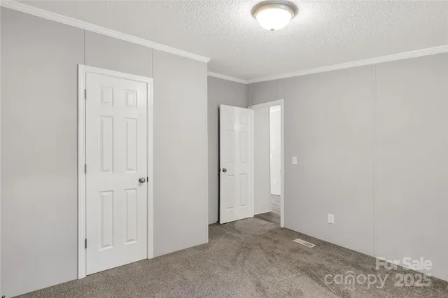 an empty room with closet area