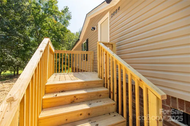 a view of wooden balcony with staircase