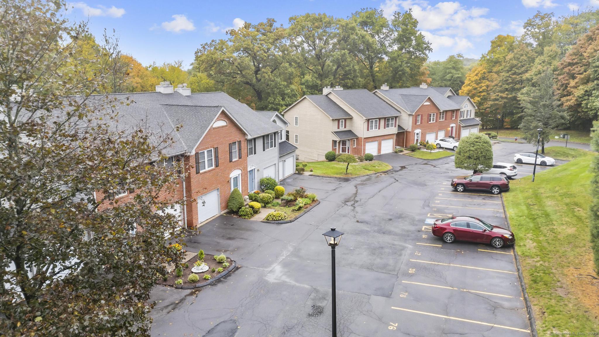 98 Crown Ridge Newington, CT 06111 - Photo 2 of 37 a view of a street with cars