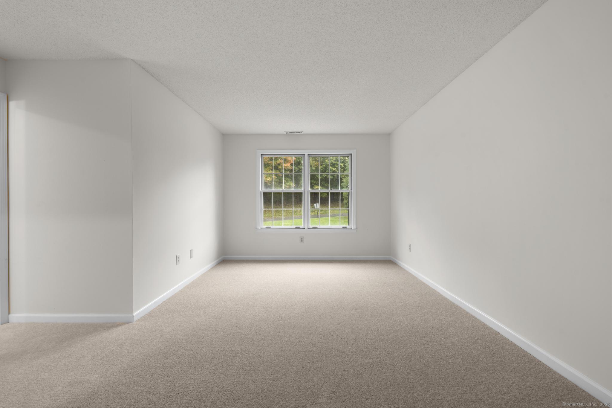 98 Crown Ridge Newington, CT 06111 - Photo 22 of 37 an empty room with windows