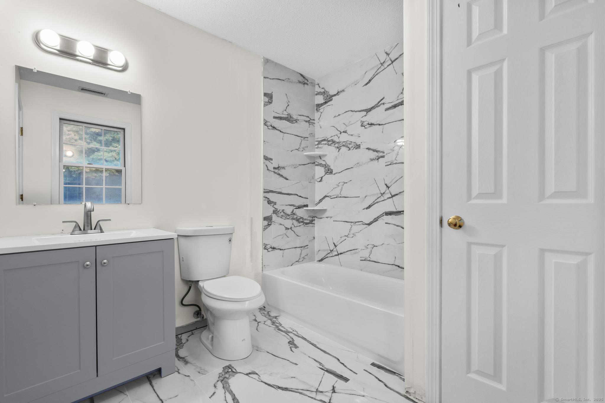 98 Crown Ridge Newington, CT 06111 - Photo 25 of 37 a bathroom with a toilet sink and shower