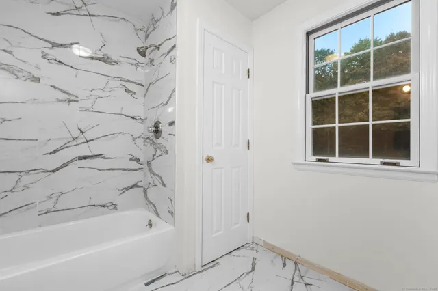 a bathroom with a bathtub