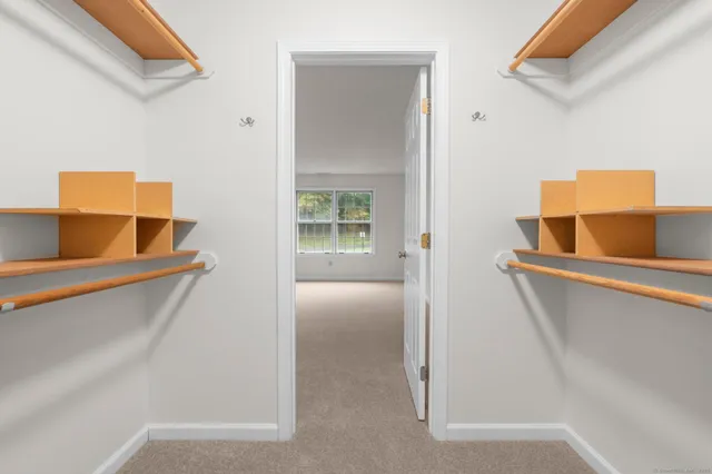 a white toilet sitting next to a bathroom sink