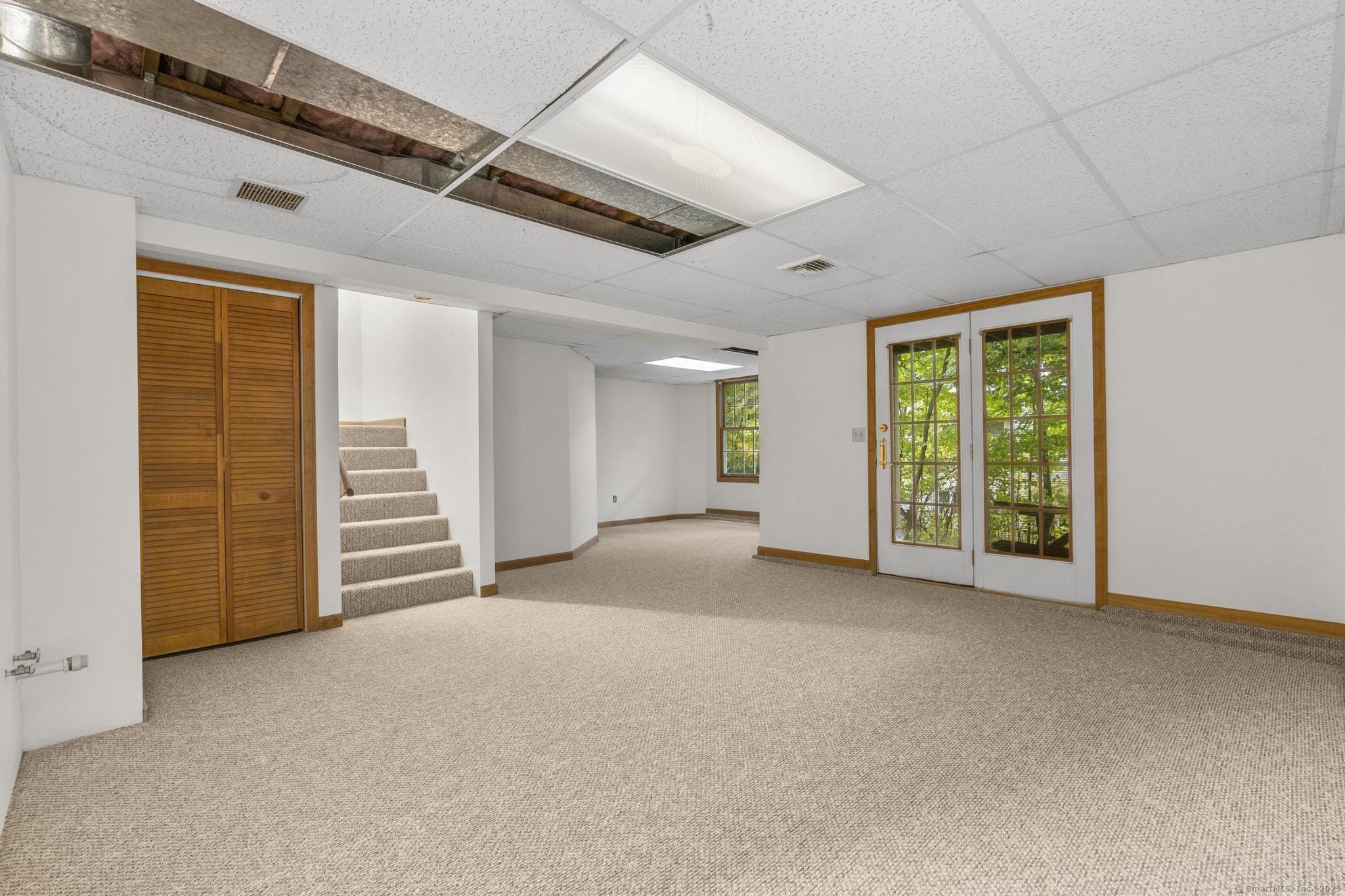 98 Crown Ridge Newington, CT 06111 - Photo 36 of 37 a view of a livingroom with an empty space and a window