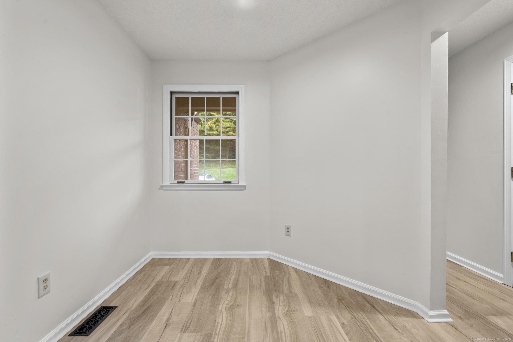 98 Crown Ridge Newington, CT 06111 - Photo 6 of 37 an empty room with a window