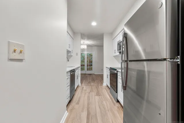 a view of entryway with wooden floor