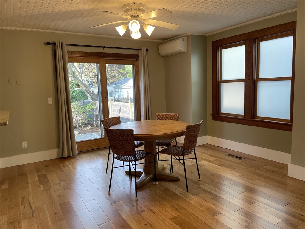 492 Elm Street Northampton, MA 01060 - Photo 19 of 31 a view of a dining room with furniture window and wooden floor
