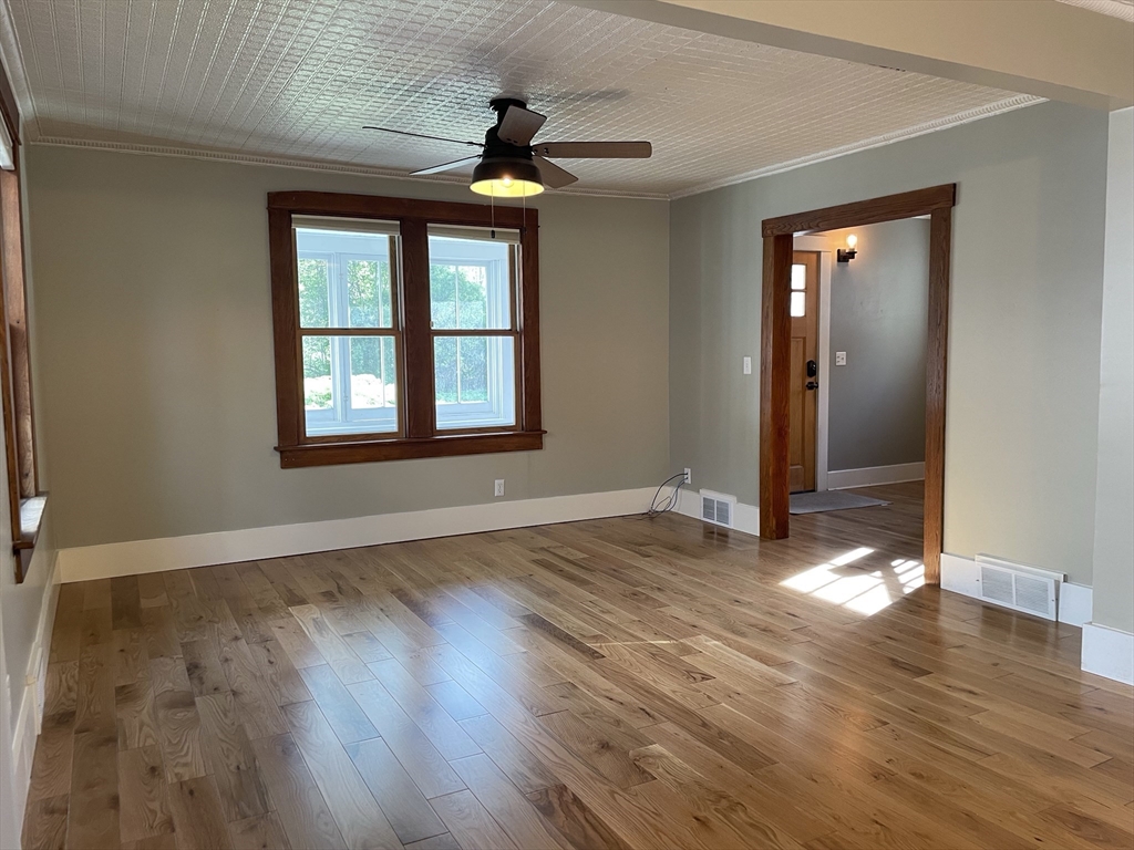 492 Elm Street Northampton, MA 01060 - Photo 21 of 31 a view of an empty room with wooden floor and a window