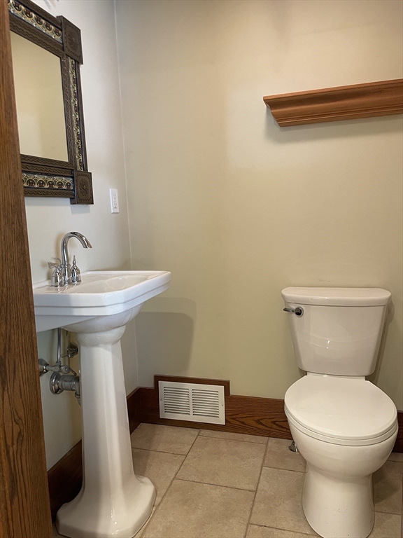 492 Elm Street Northampton, MA 01060 - Photo 22 of 31 a bathroom with a toilet sink and mirror
