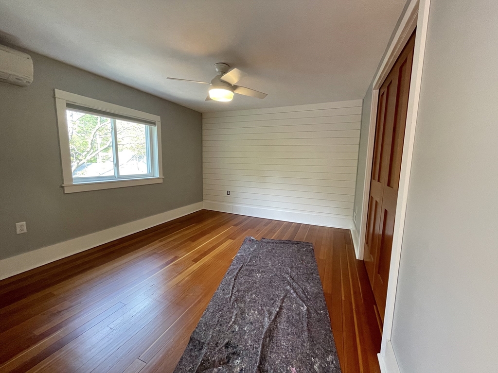 492 Elm Street Northampton, MA 01060 - Photo 26 of 31 an empty room with wooden floor and windows
