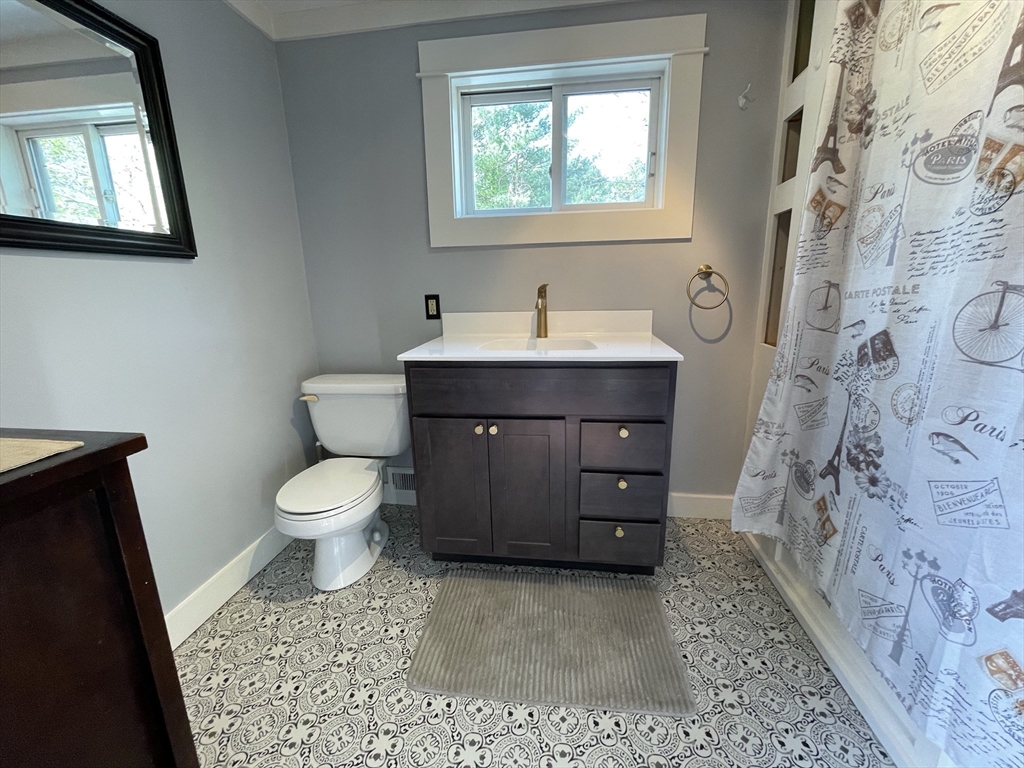 492 Elm Street Northampton, MA 01060 - Photo 30 of 31 a bathroom with a sink a toilet and a window