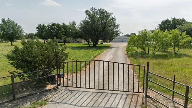 a view of balcony with wooden floor and fence