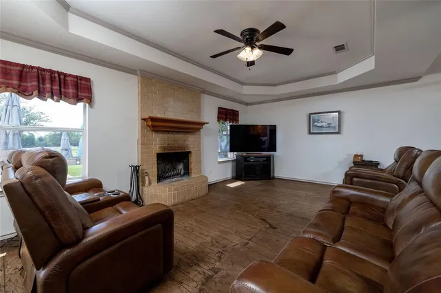 a bedroom with a bed dresser and a window