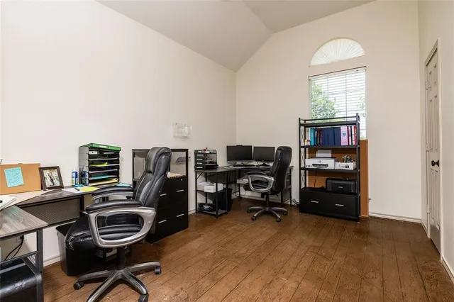a view of a workspace with furniture and gym equipment