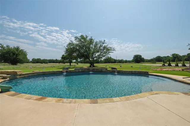 an aerial view of a house with outdoor space