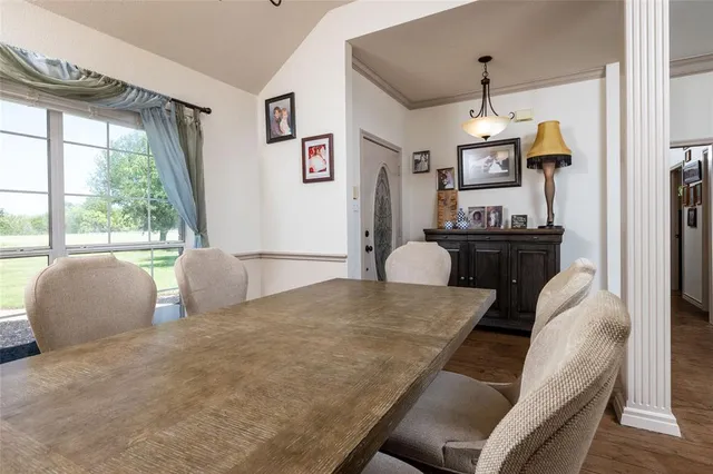 a living room with furniture and a ceiling fan