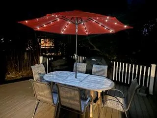 a patio with table and chairs