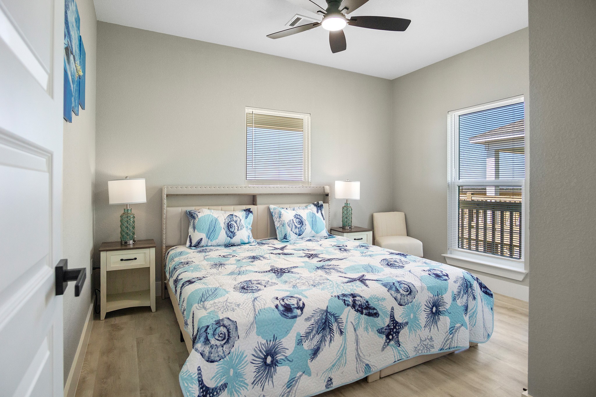 1297 Mabry Port Bolivar, TX 77650 - Photo 20 of 38 a bedroom with a bed and a chandelier