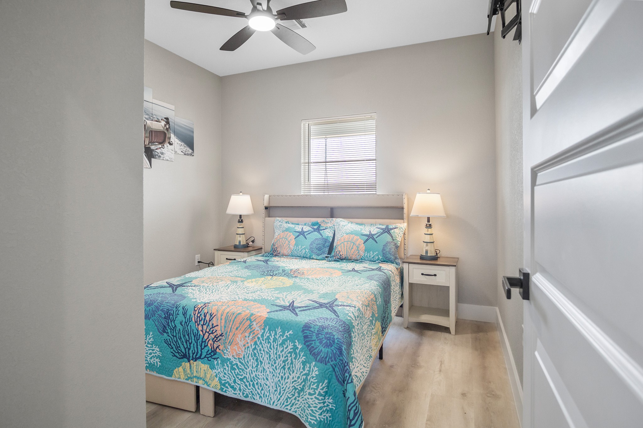 1297 Mabry Port Bolivar, TX 77650 - Photo 23 of 38 a bedroom with a bed and a chandelier