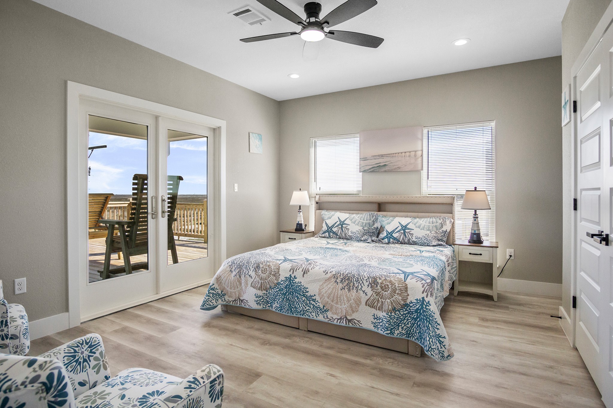 1297 Mabry Port Bolivar, TX 77650 - Photo 24 of 38 a bedroom with a bed and wooden floor