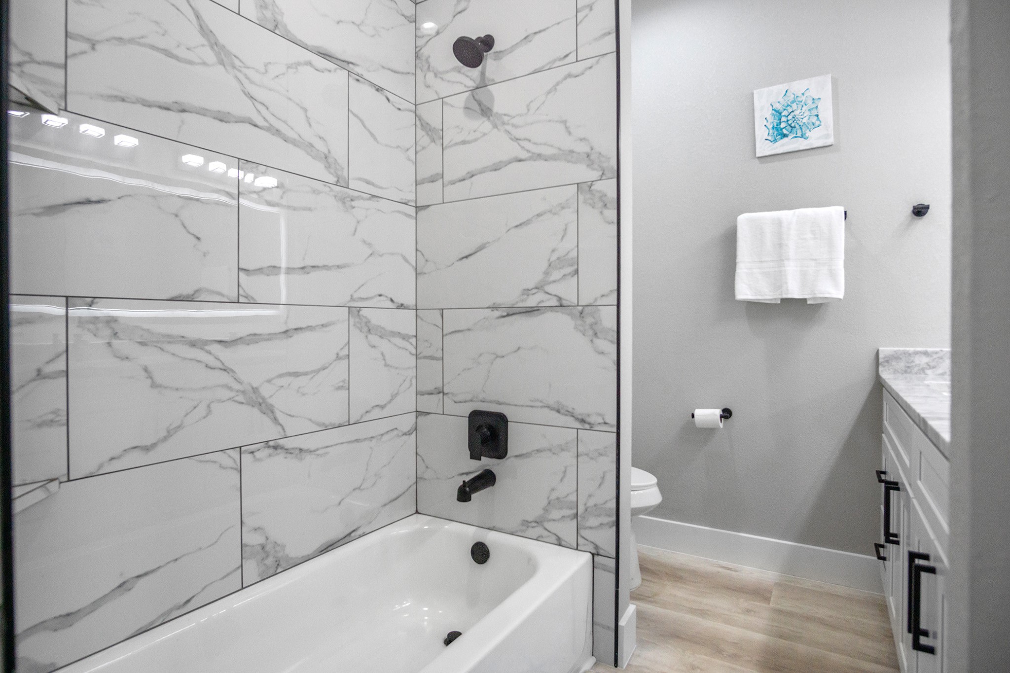 1297 Mabry Port Bolivar, TX 77650 - Photo 26 of 38 a bathroom with a bathtub and shower