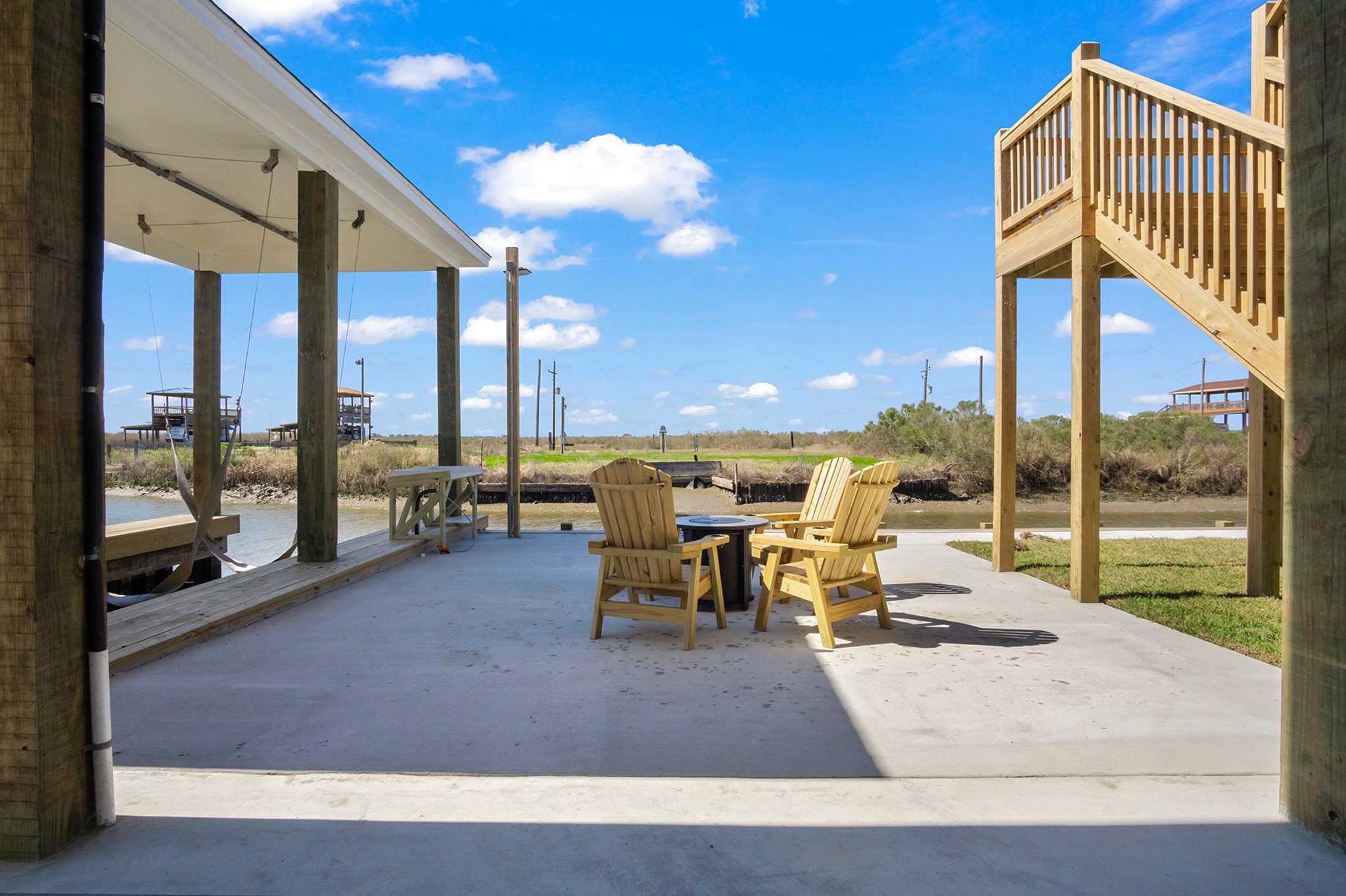 1297 Mabry Port Bolivar, TX 77650 - Photo 32 of 38 a view of a patio with a dining table and chairs with the view of the patio