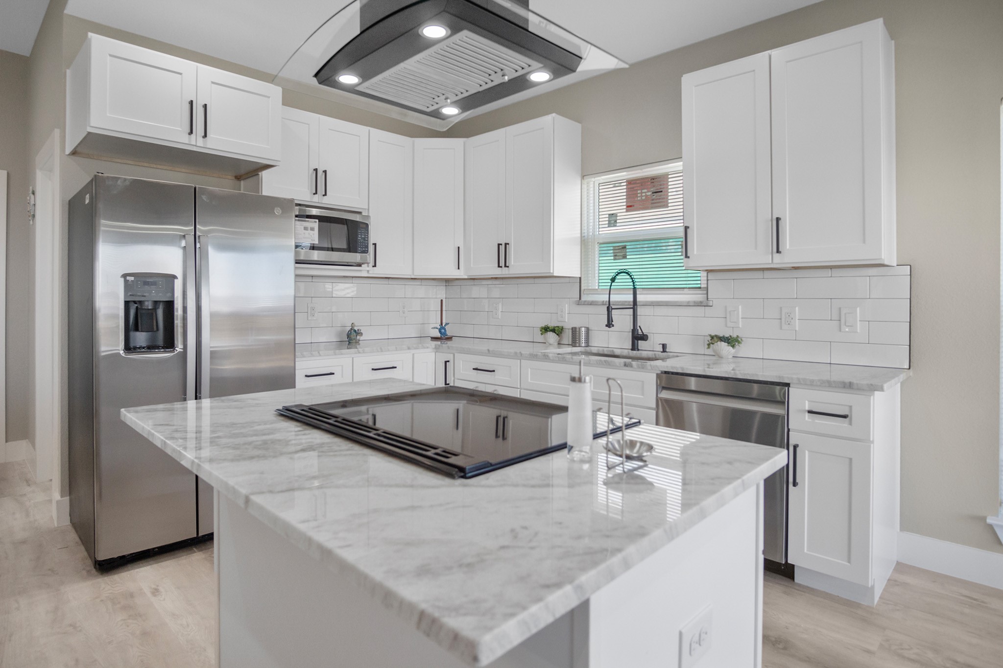 1297 Mabry Port Bolivar, TX 77650 - Photo 4 of 38 a kitchen with stainless steel appliances granite countertop a sink stove and refrigerator