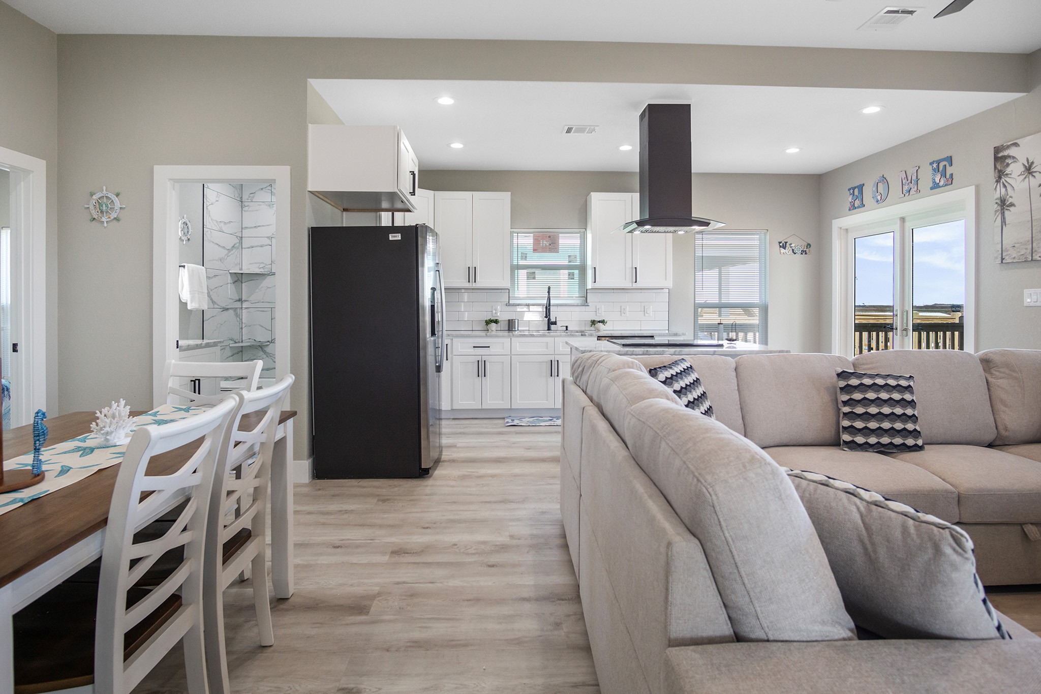 1297 Mabry Port Bolivar, TX 77650 - Photo 6 of 38 a living room with stainless steel appliances furniture and a kitchen view